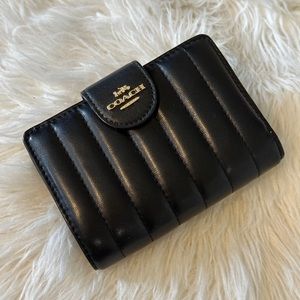Coach medium corner zip wallet quilted